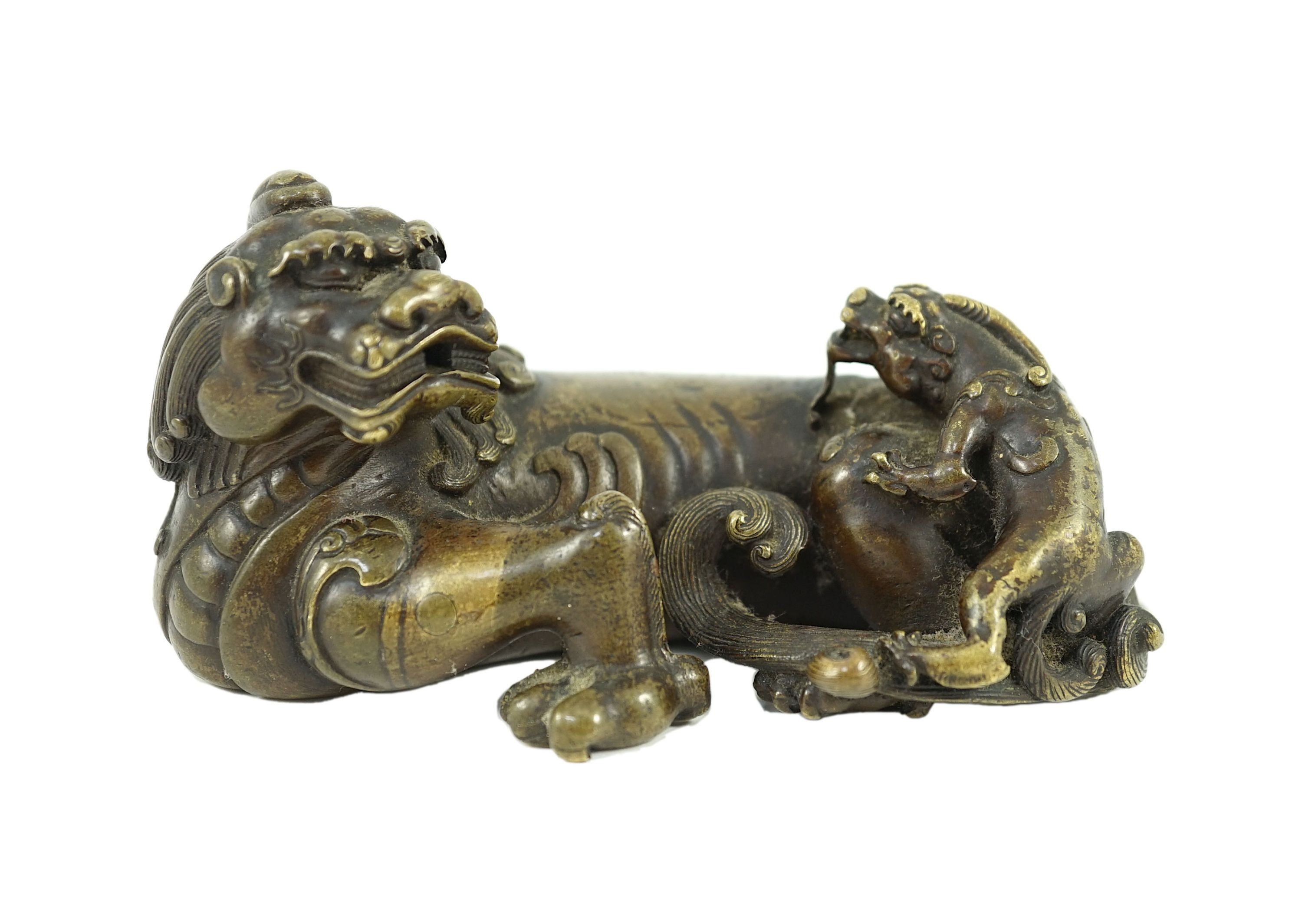 A finely cast Chinese bronze lion-dog and cub scroll weight, 17th/18th century, 14cm long, one foot and a cub lacking